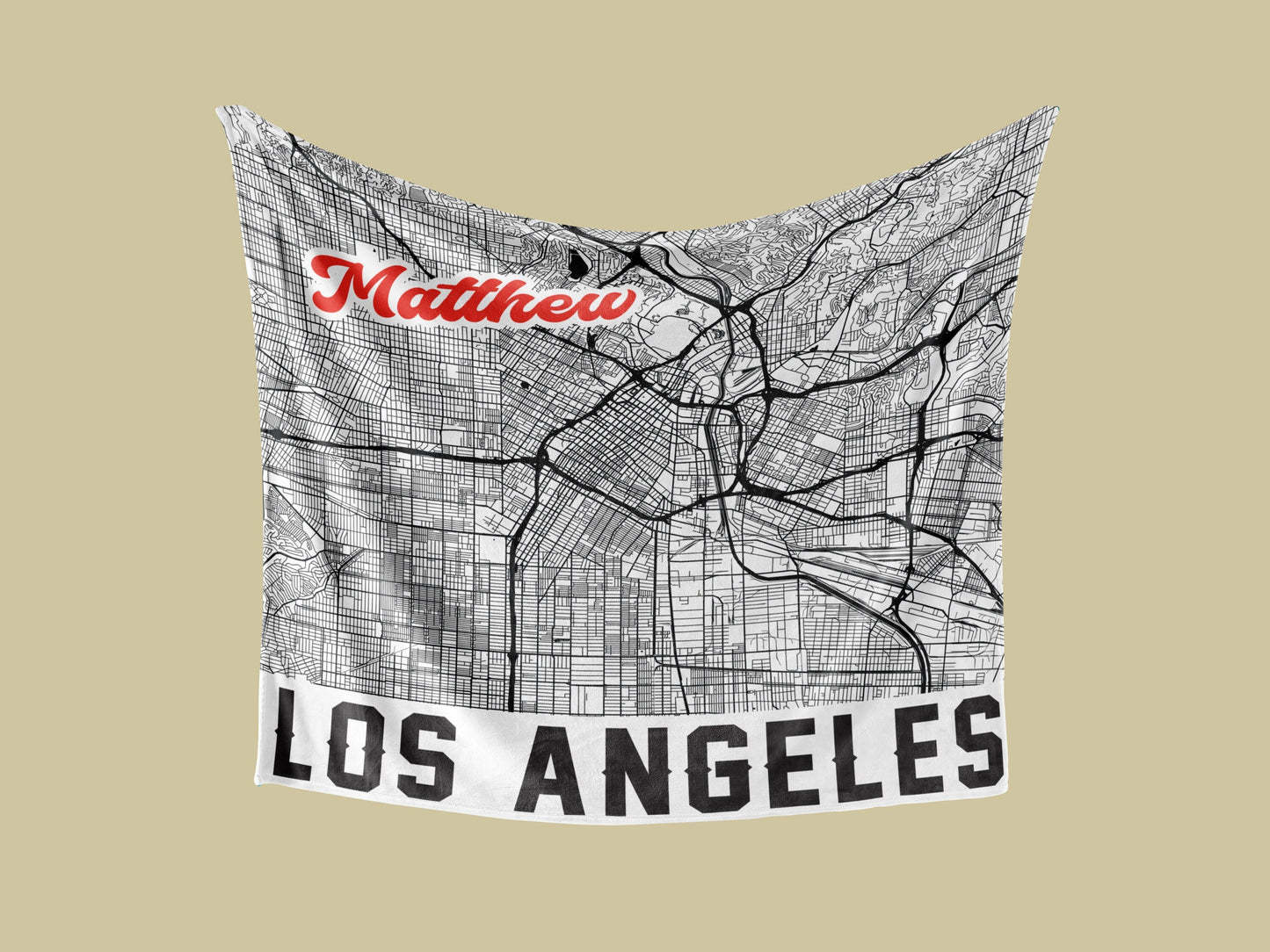 A white blanket in a yellow background with personalized city map of los angeles and customized name