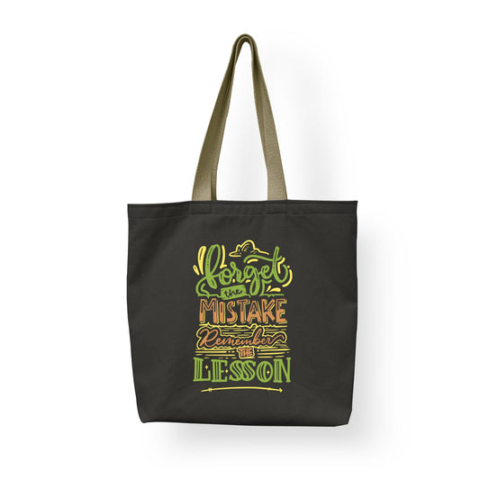 A cotton shopping tote bag by Sam and Zoey featuring the quote "Forget The Mistake, Remember The Lesson," adorned with a stylish and motivational design perfect for eco-friendly shoppers and teachers