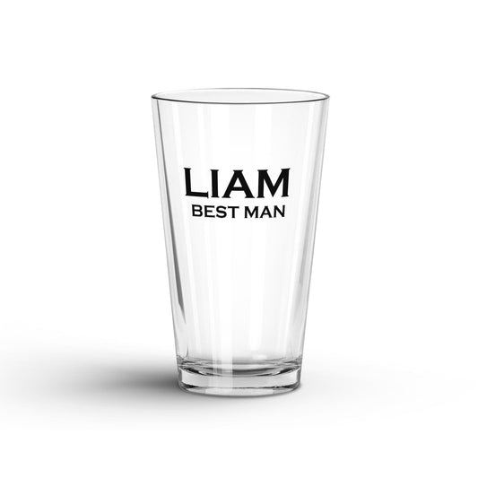 A tranparent Glass Tumbler with Personalized name and 'Best Man' printed on a white surface