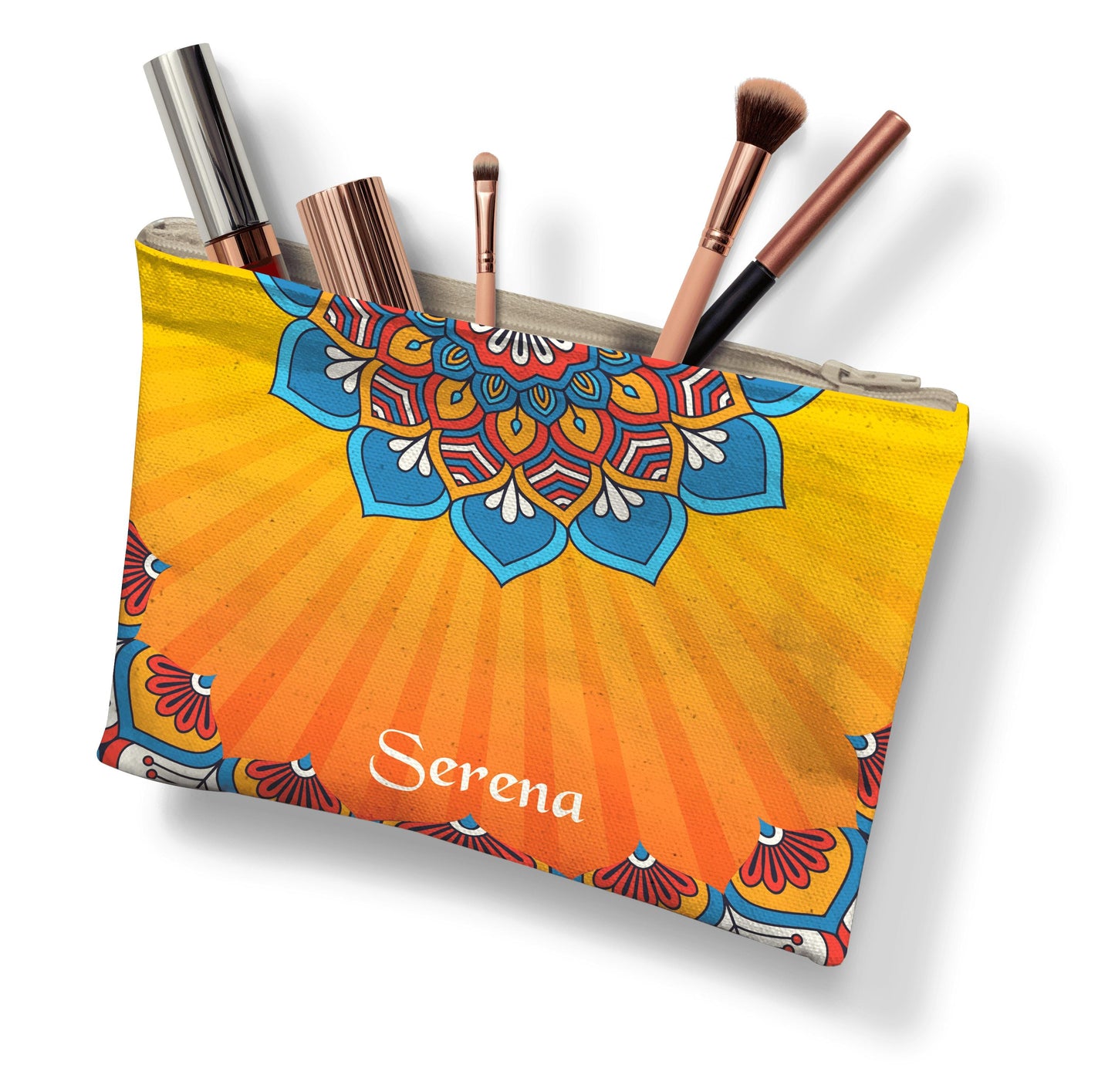 A colorful makeup pouch with an intricate mandala design, personalized with "Serena," holding several makeup brushes and beauty products