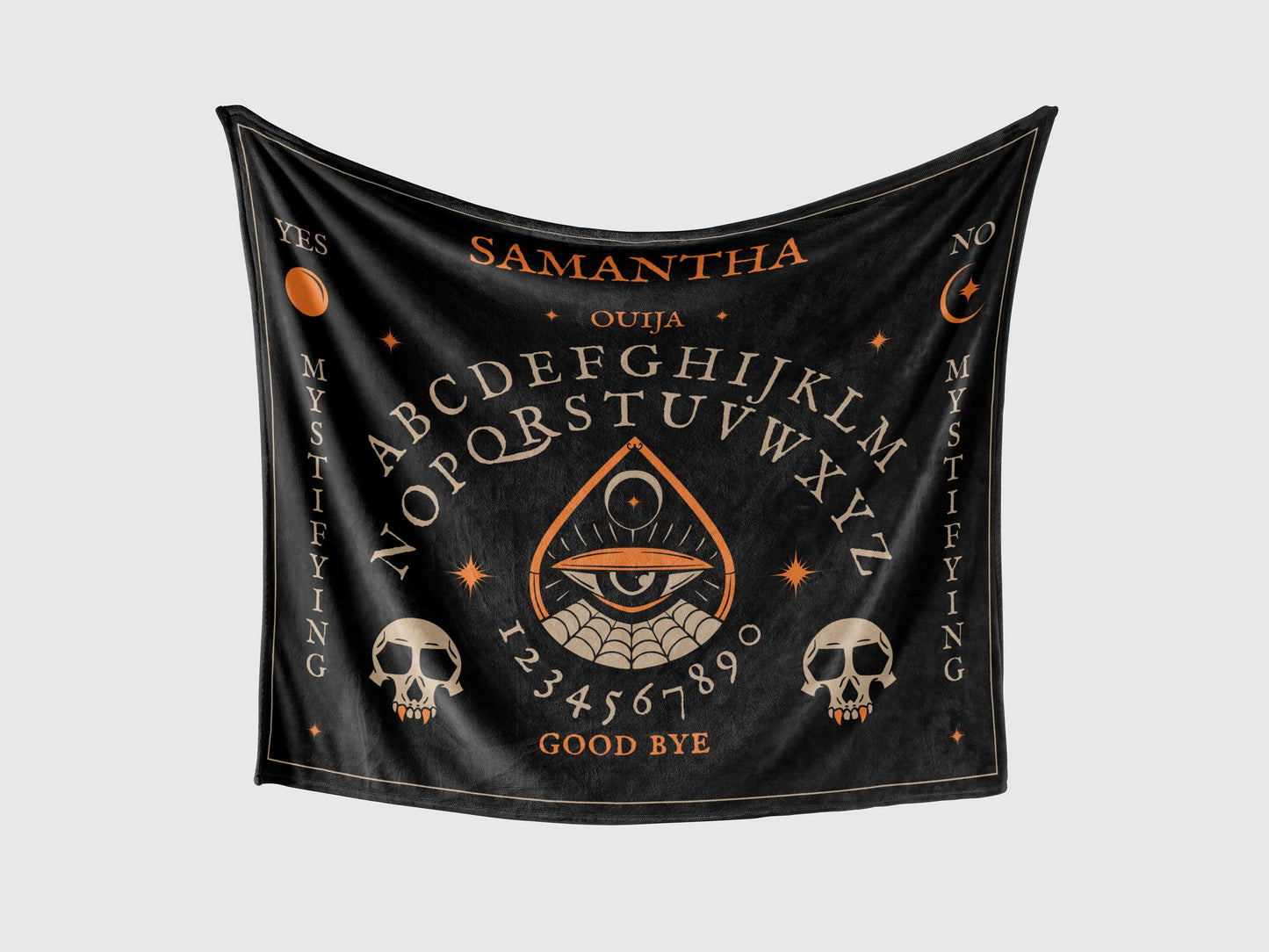A throw blanket with a Halloween Ouija board design, featuring detailed whimsical ghosts, pumpkins, cloud and sky in vibrant colors.