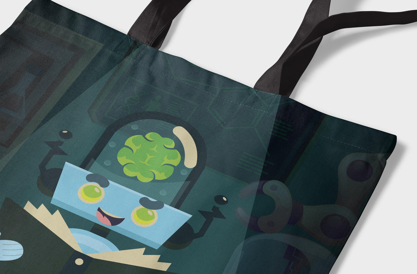 Close-up of a tote bag featuring a cartoon alien scientist with a green brain, black handles, and a white background.