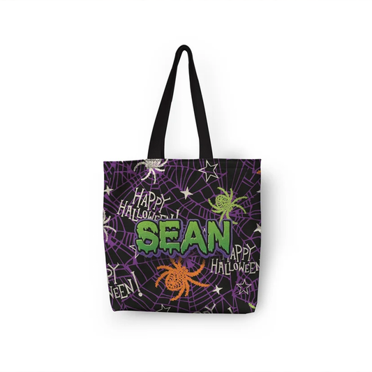 Halloween spider web tote bag with custom name on black canvas in spooky green font
