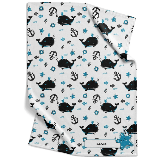 White sea creature baby blanket personalized with custom name in soft ocean fleece design
