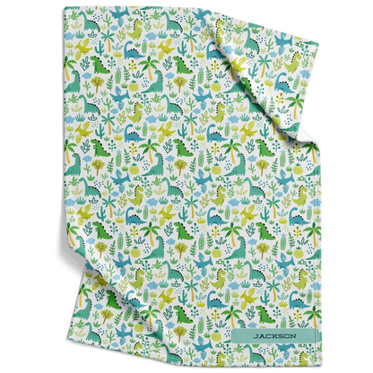 Dinosaur land baby blanket personalized with custom name in blue green fleece for boys
