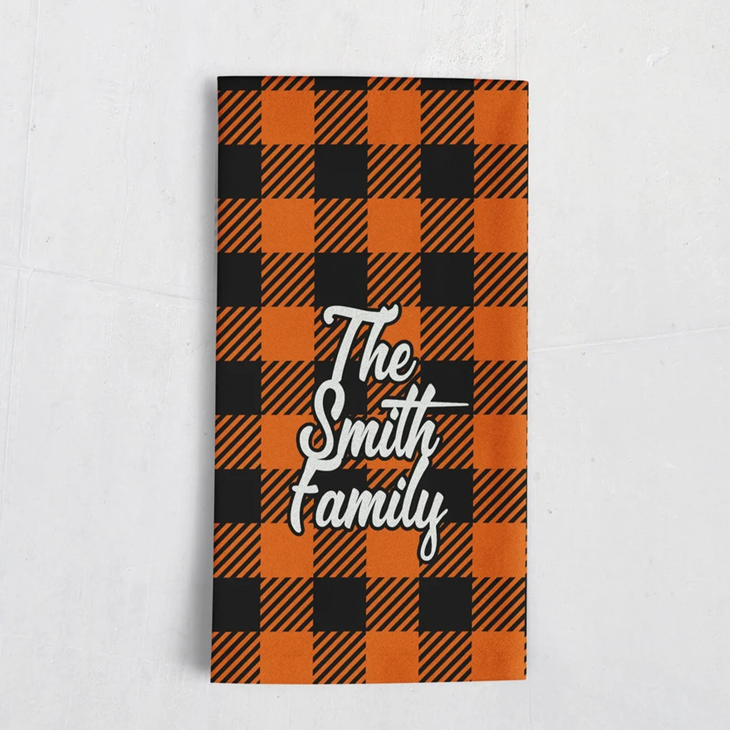 Black and orange gingham tea towel personalized with custom name for fall kitchen decor

