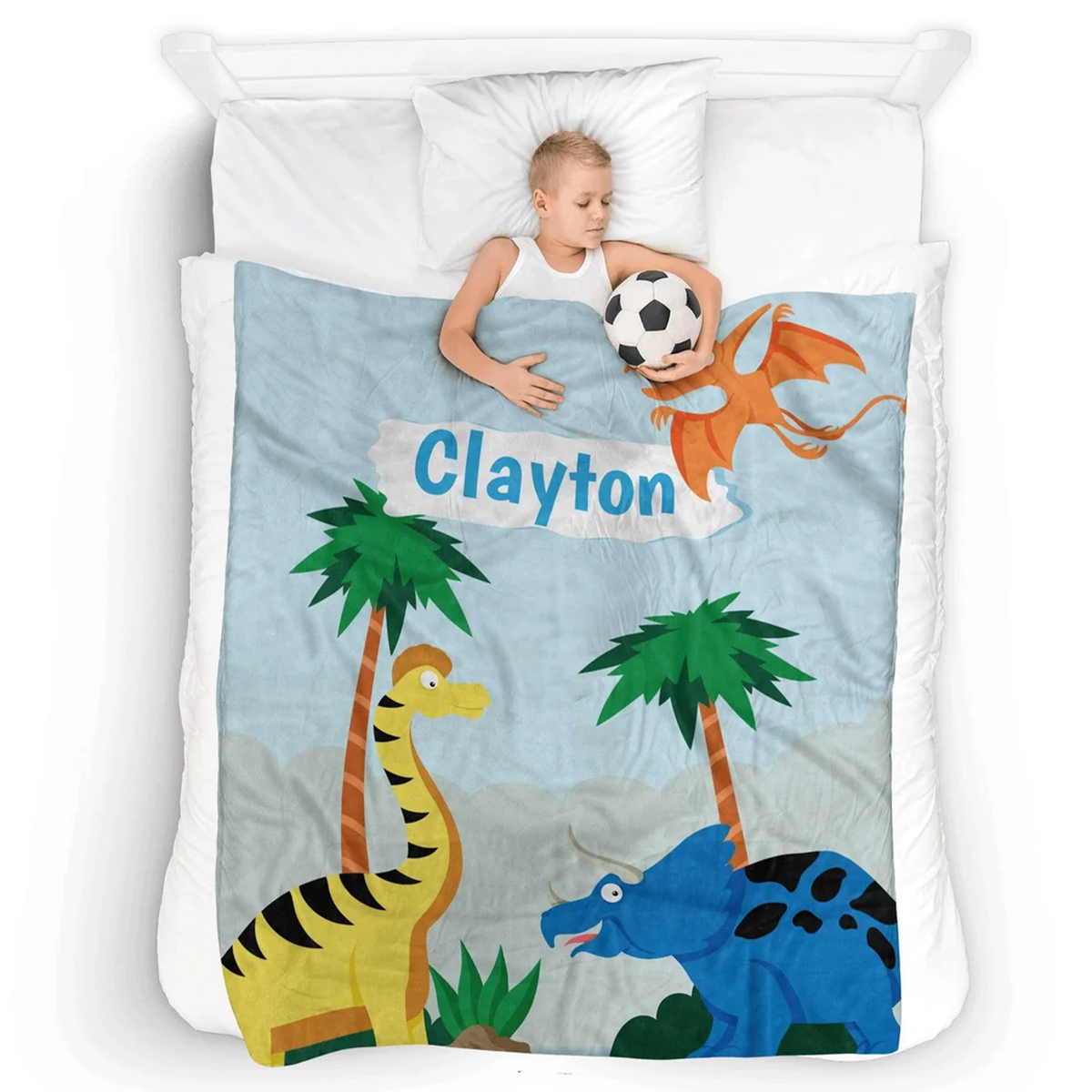 Child wrapped in personalized cute dinosaur throw blanket as birthday gift for kids
