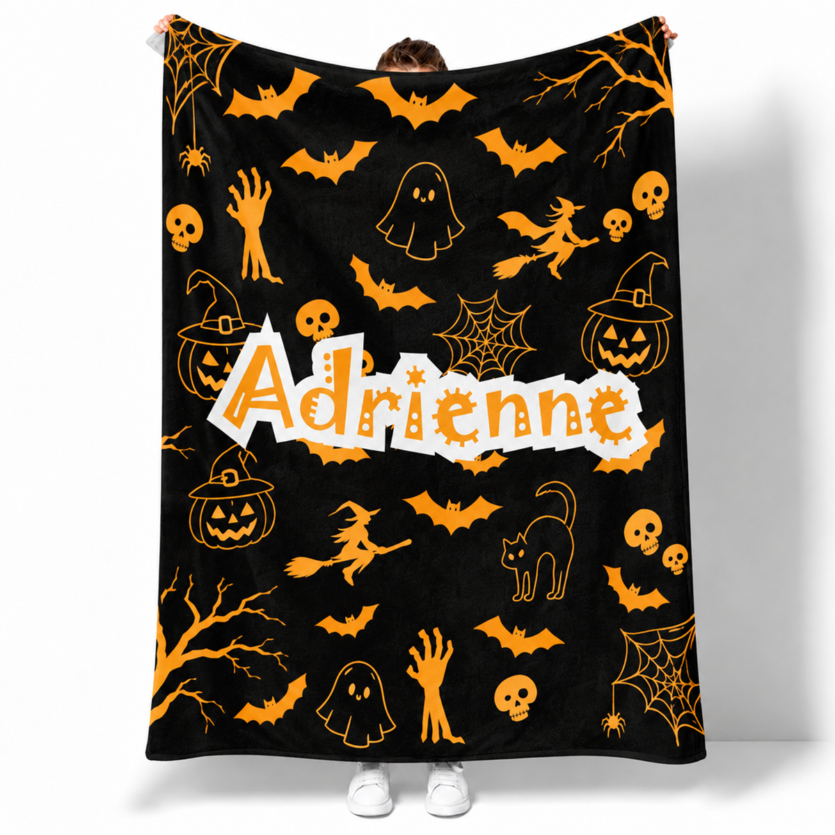 Personalized pumpkin Halloween throw blanket with custom name in vibrant fleece design
