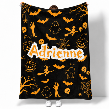 Personalized pumpkin Halloween throw blanket with custom name in vibrant fleece design
