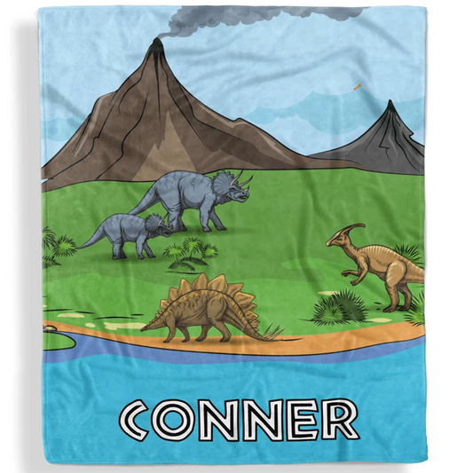 Dinosaur park kids throw blanket personalized with custom name in bold fleece design
