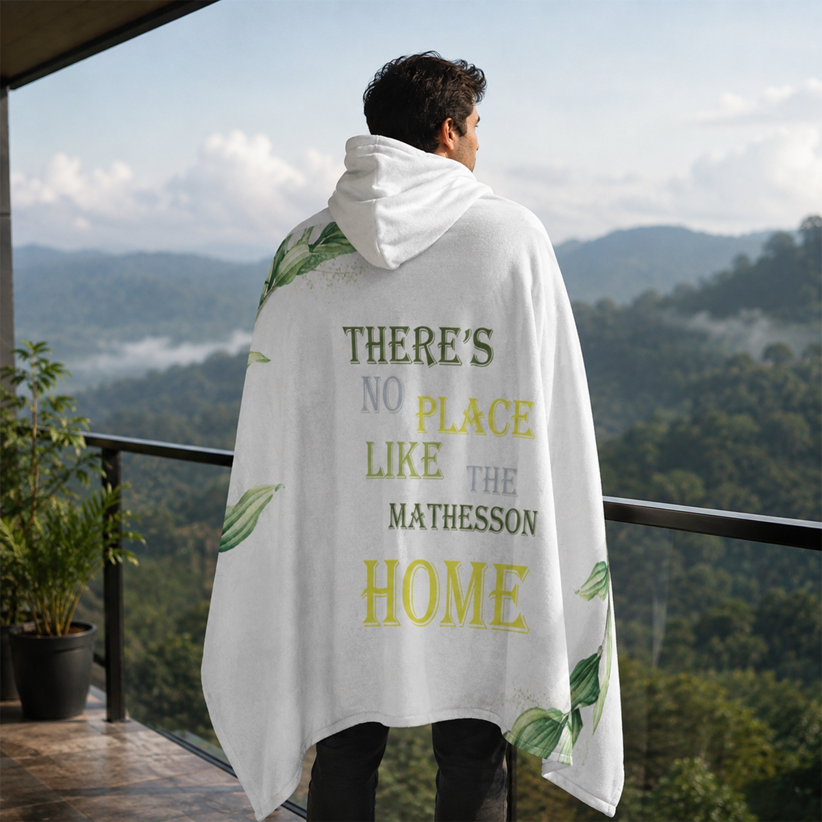 Person wearing personalized no place like home hooded blanket as meaningful birthday gift
