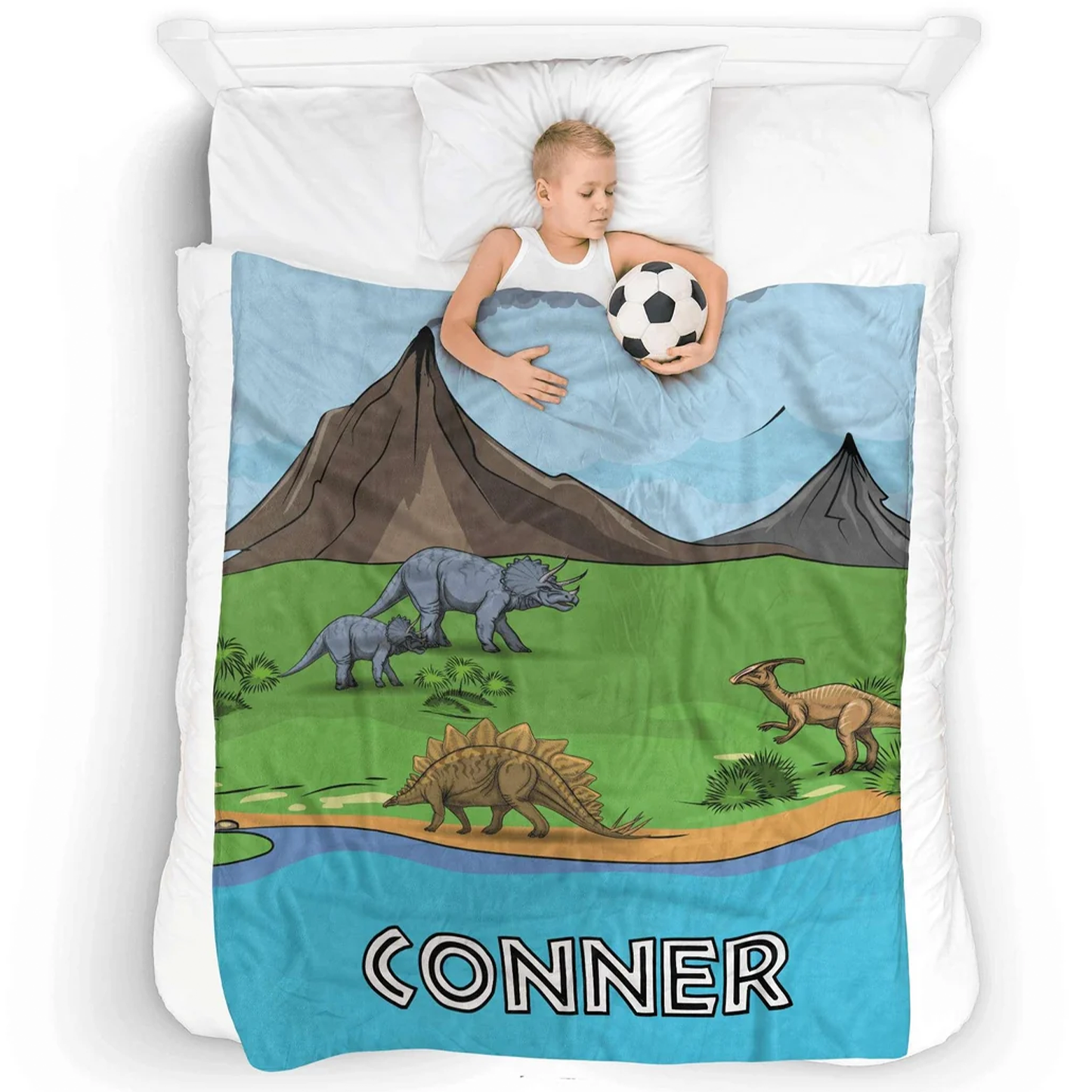 Child wrapped in personalized dinosaur park throw blanket as birthday dino themed gift
