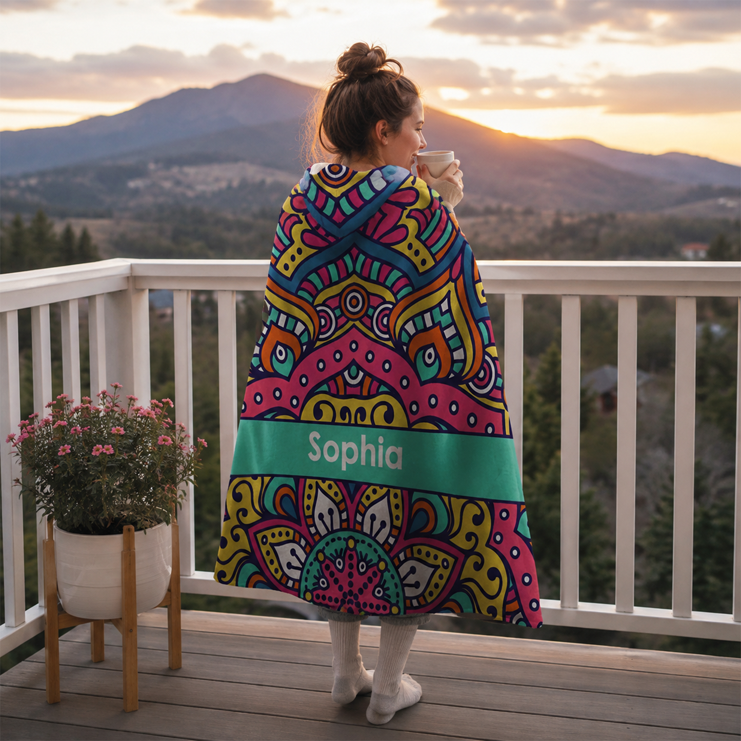 Person wearing personalized satin hooded blanket as meaningful birthday gift
