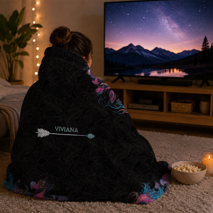 Person wearing personalized neon boho arrow hooded blanket as meaningful birthday gift
