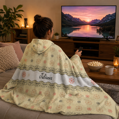 Person wearing personalized floral lace hooded blanket as meaningful birthday gift
