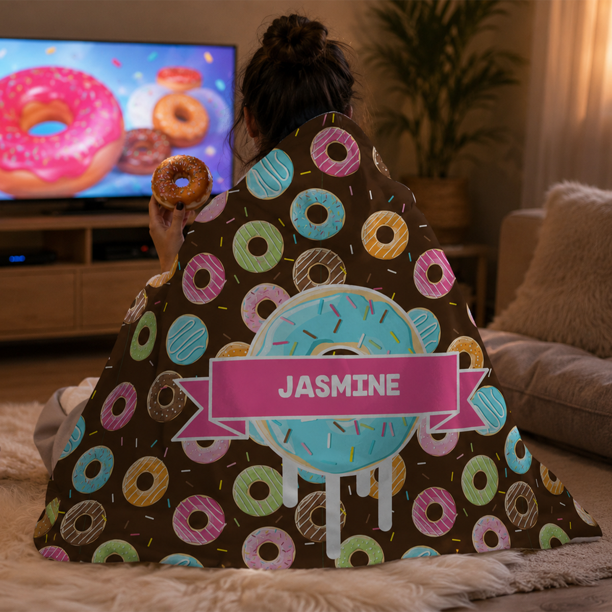 Person wearing personalized donutz hooded blanket as meaningful birthday gift
