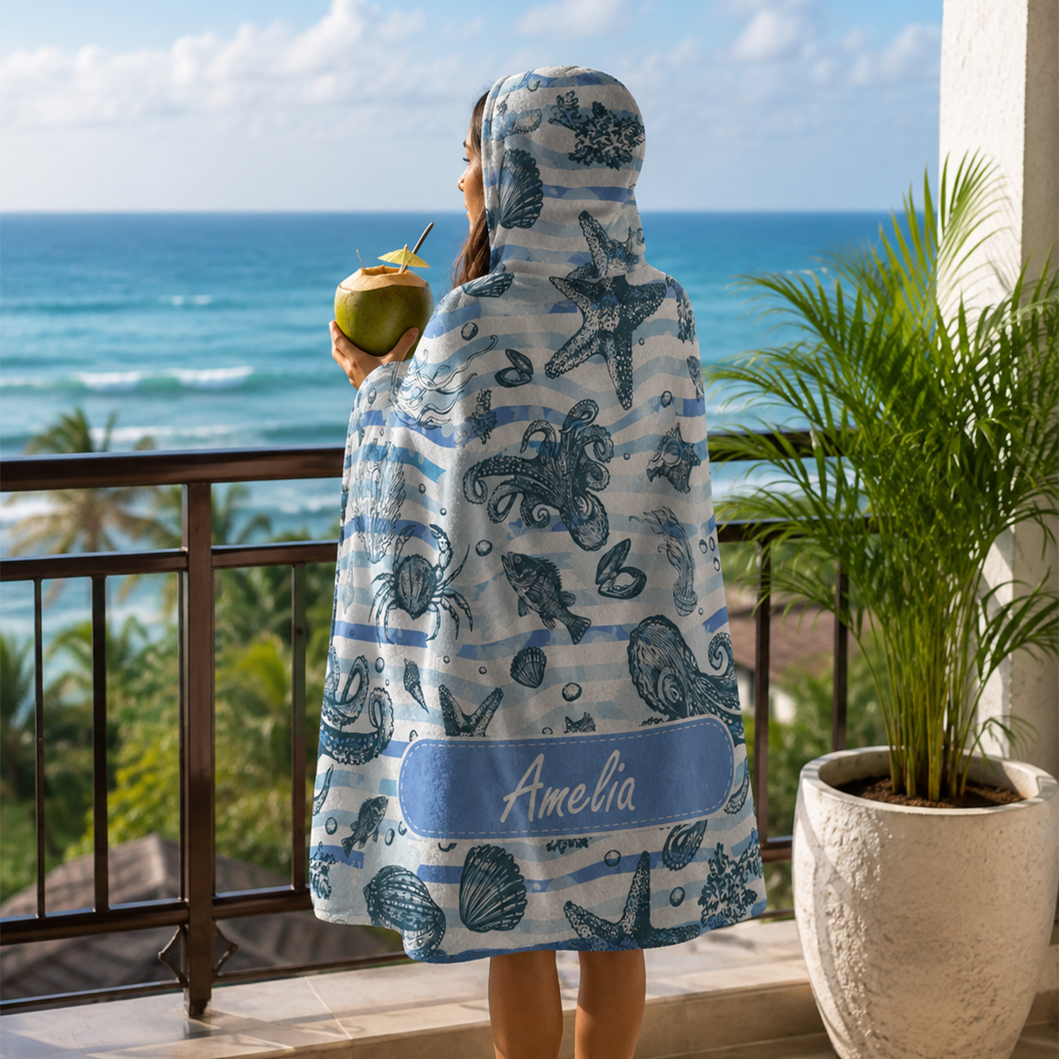 Person wearing personalized sealife hooded blanket as meaningful birthday gift
