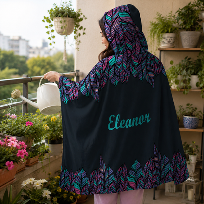 Person wearing personalized boho feathers hooded blanket as meaningful birthday gift
