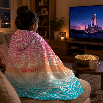 Woman wearing personalized aztec ombre hooded blanket as bold birthday gift
