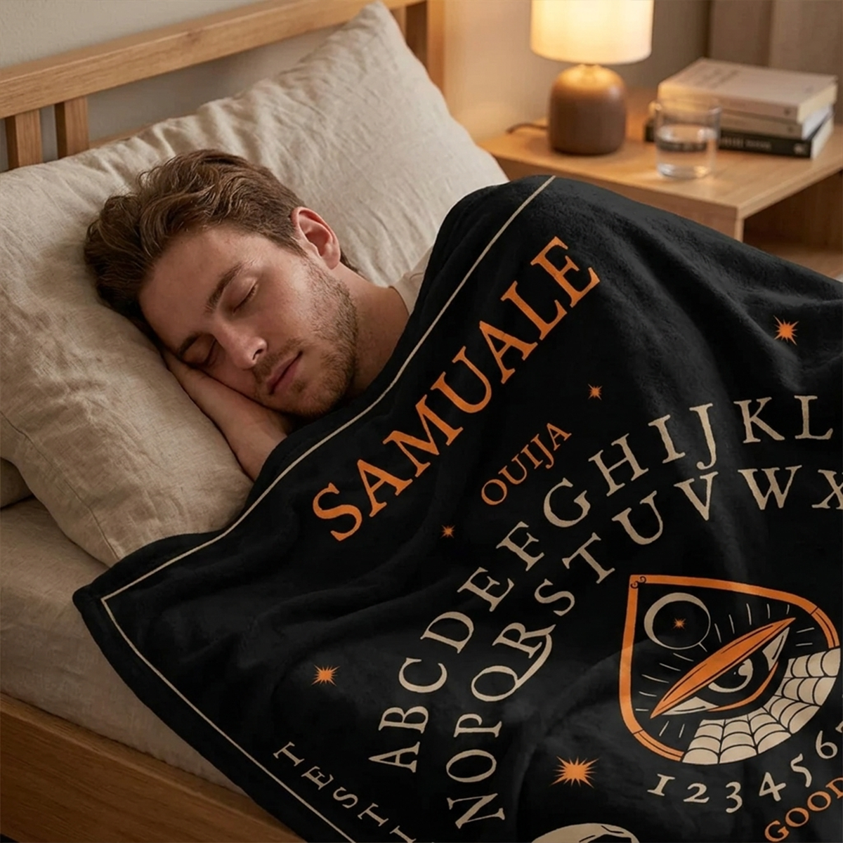 Person wrapped in ouija board throw blanket as spooky Halloween seasonal gift
