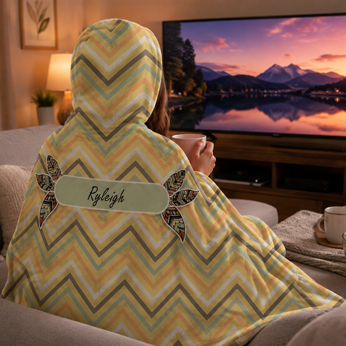 Person wearing personalized dreaming of chevron hooded blanket as meaningful birthday gift

