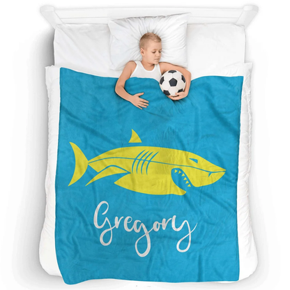 Child wrapped in personalized flat shark throw blanket as funny birthday gift for kids
