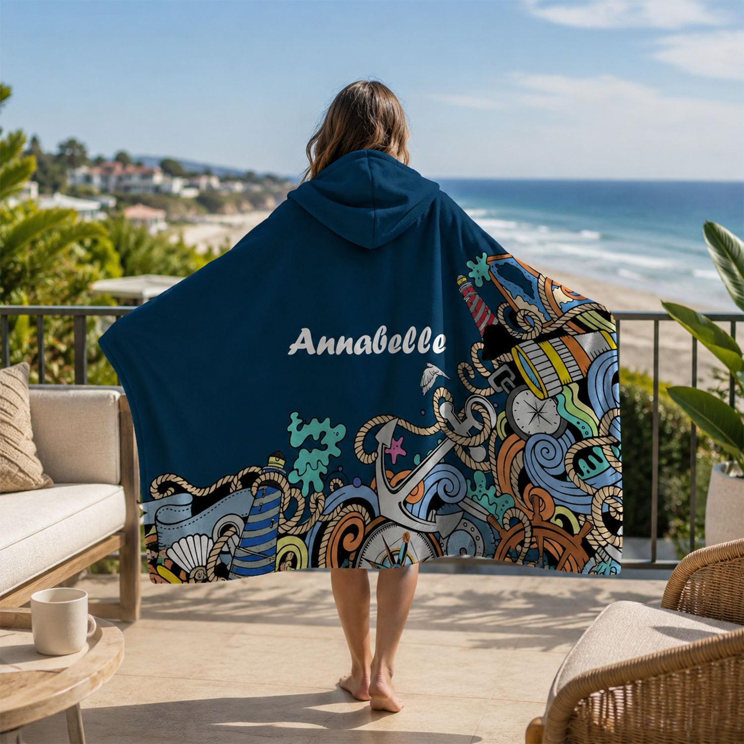 Person wearing personalized nautical blast hooded blanket as meaningful birthday gift
