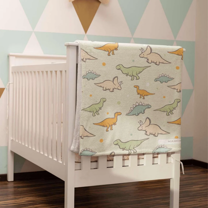 Custom name on colorful dinosaur fleece baby blanket as fun baby boy shower gift
