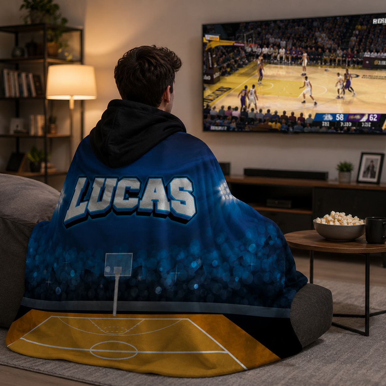 Basketball fan wearing personalized stadium hooded blanket as birthday sports gift
