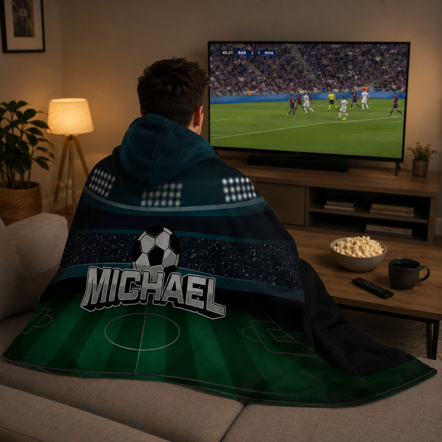 Soccer fan wearing personalized stadium hooded blanket as game day birthday gift
