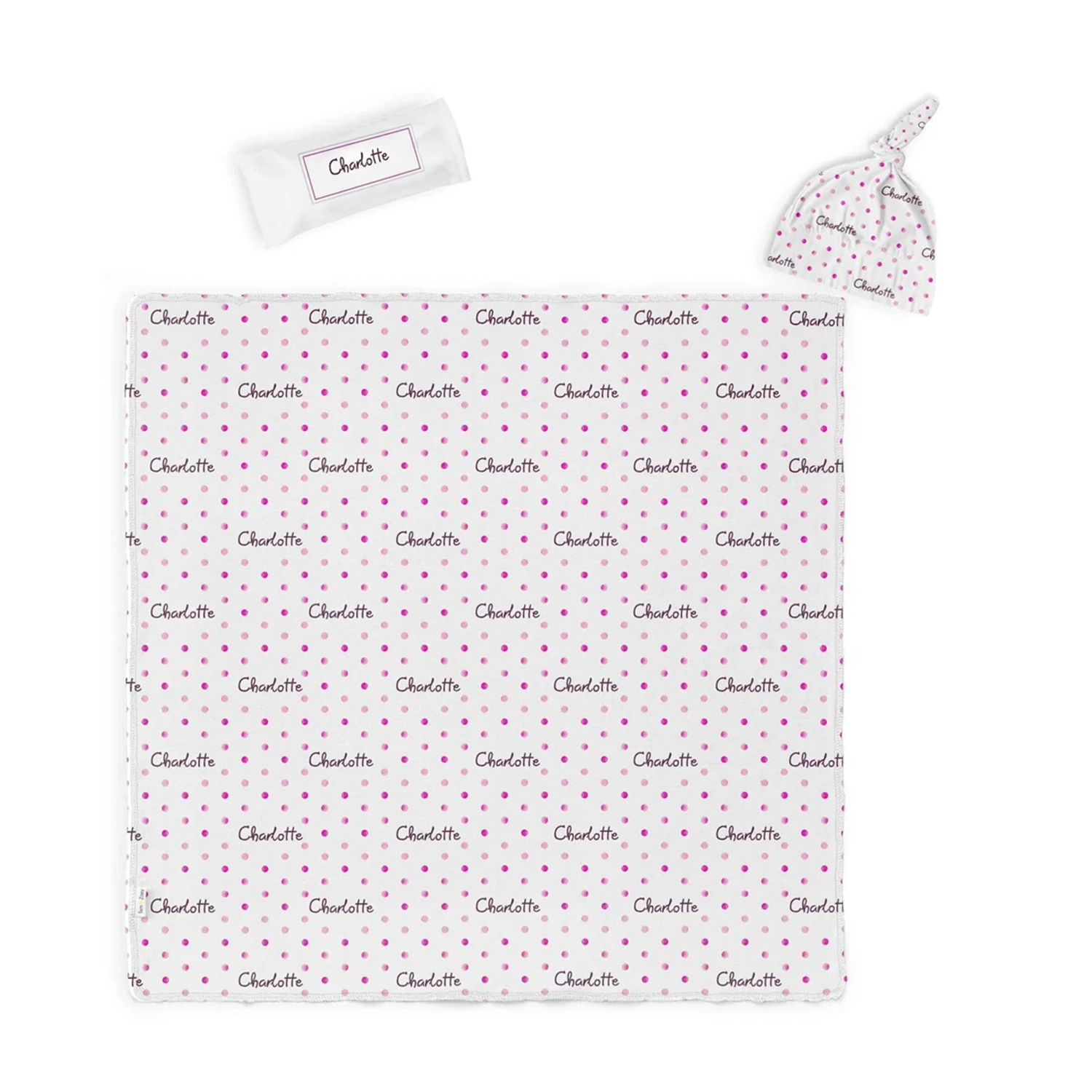 Close-up of custom name on watercolor polka dot cotton baby swaddle set
