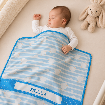 Baby wrapped in personalized sky sheep blue fleece blanket as calming shower gift
