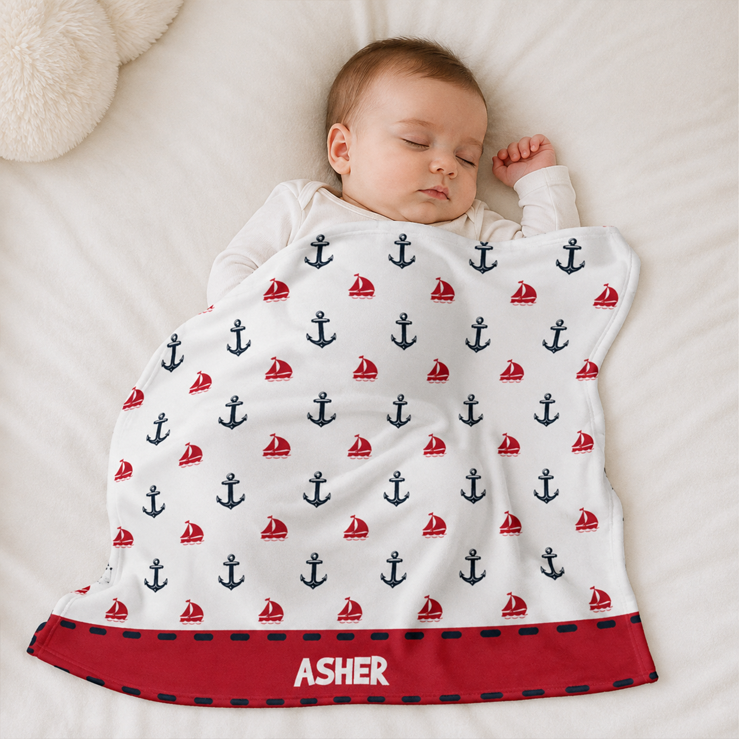 Baby wrapped in personalized anchor print nautical fleece blanket as shower gift
