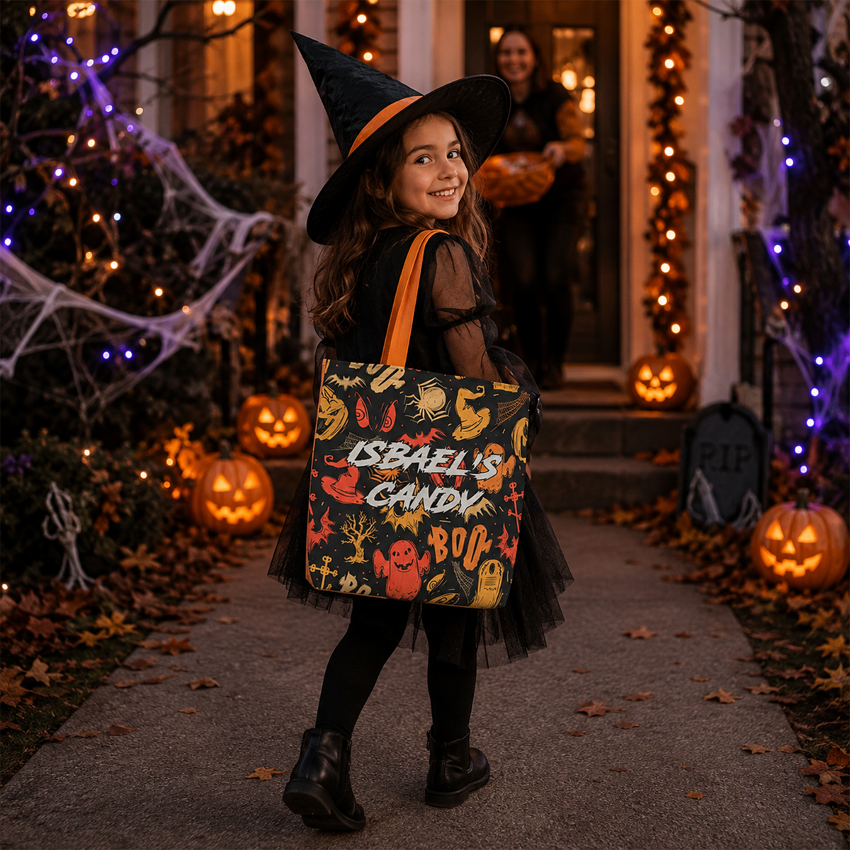 Child holding personalized ghouls and ghosts Halloween tote as spooky seasonal gift
