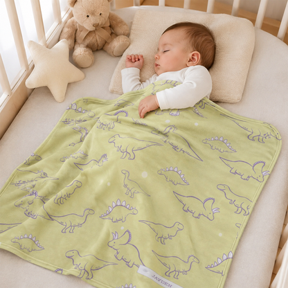Baby wrapped in personalized lemon lavender dinosaur fleece blanket as shower gift
