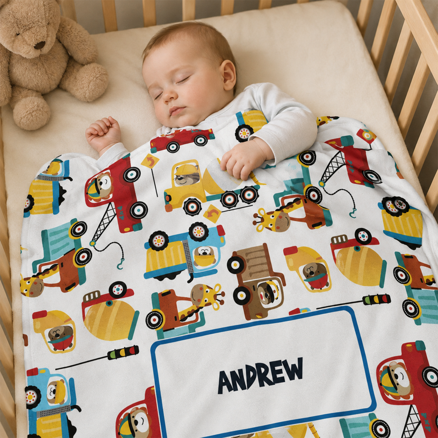 Baby boy wrapped in personalized construction toys fleece blanket as shower gift
