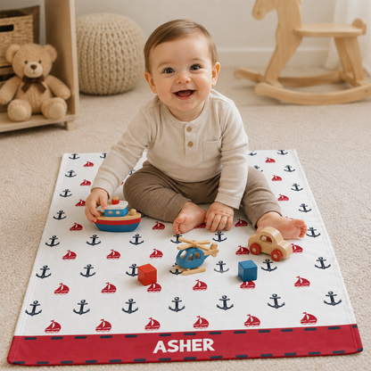 Close-up of custom name on anchor print nautical fleece baby blanket for newborns
