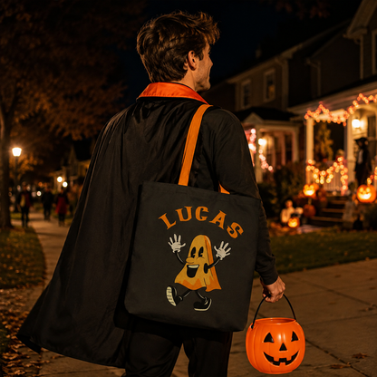 Adult holding personalized Halloween ghost march tote bag for trick or treat night
