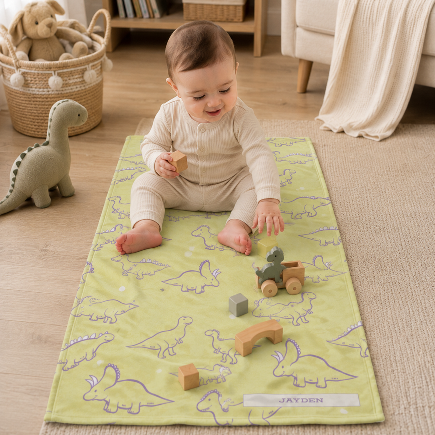 Close-up of custom name on lemon lavender dinosaur fleece baby blanket design
