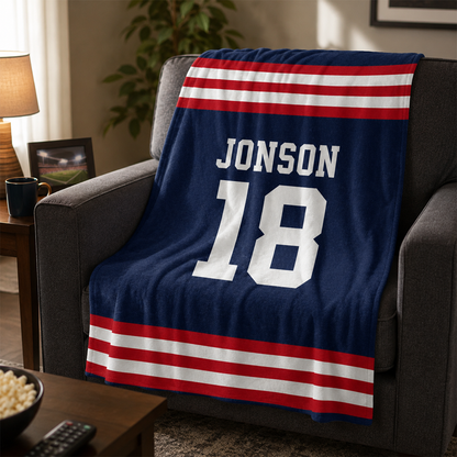 Close-up of personalized name and number on custom sports jersey fleece throw blanket
