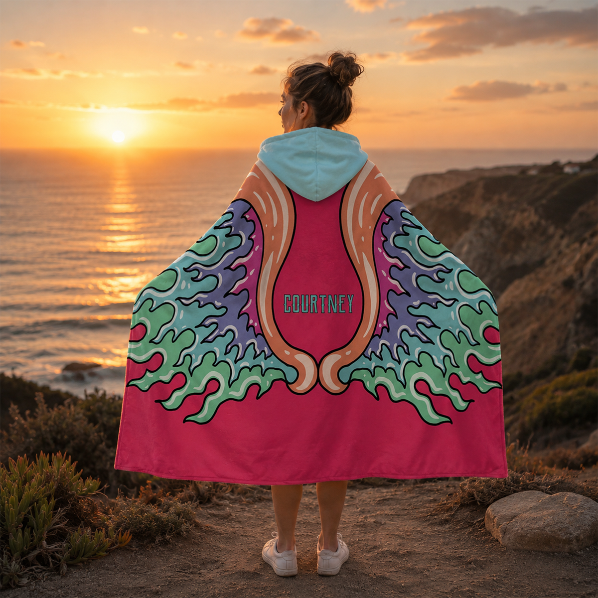 Person wearing personalized angel wing hooded fleece blanket as meaningful gift
