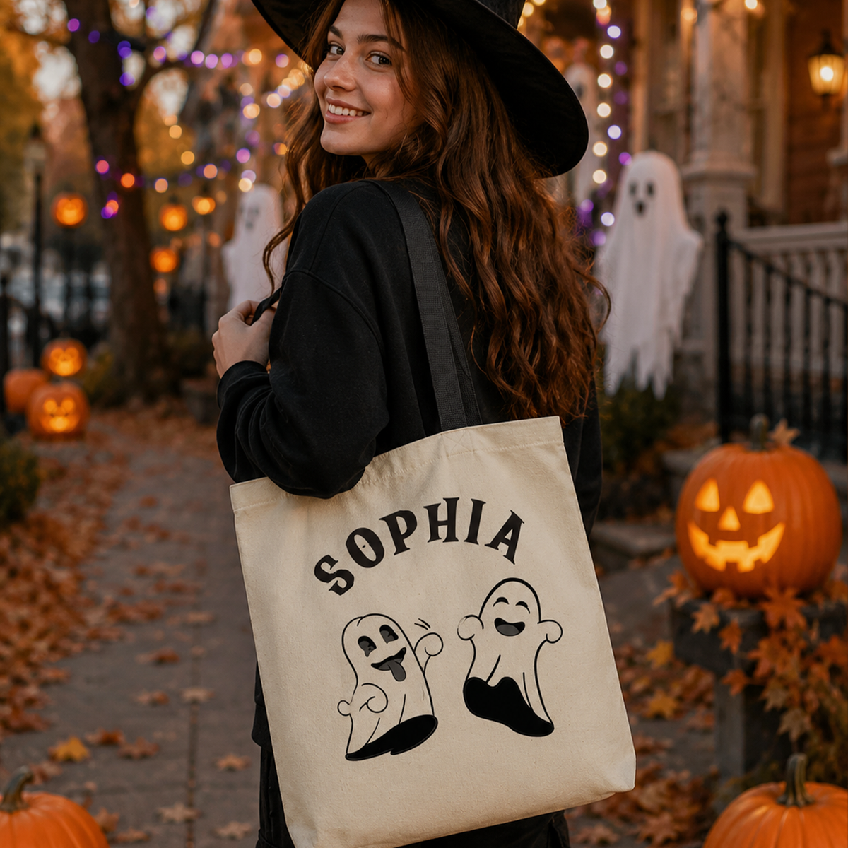 Person holding personalized tricks and treats Halloween tote bag for spooky season
