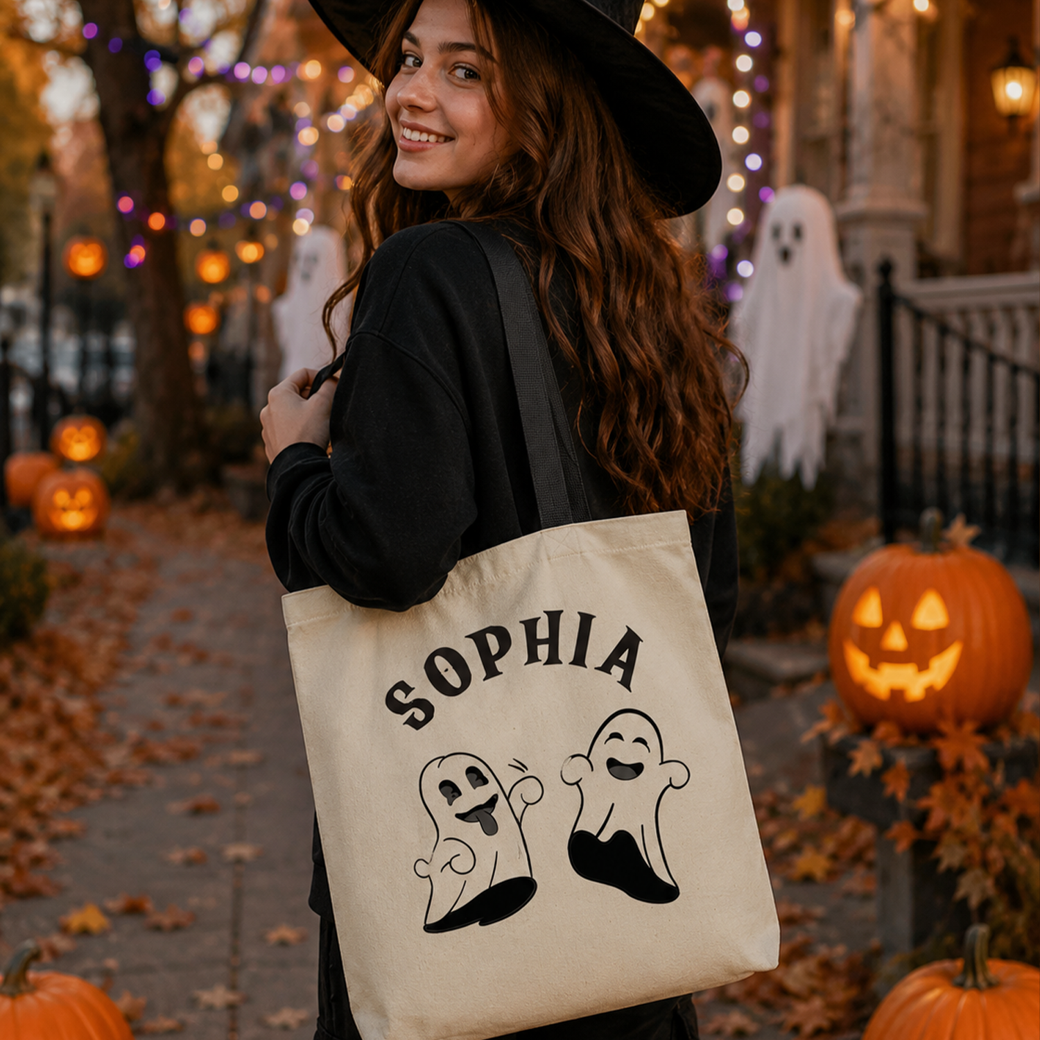 Person holding personalized tricks and treats Halloween tote bag for spooky season
