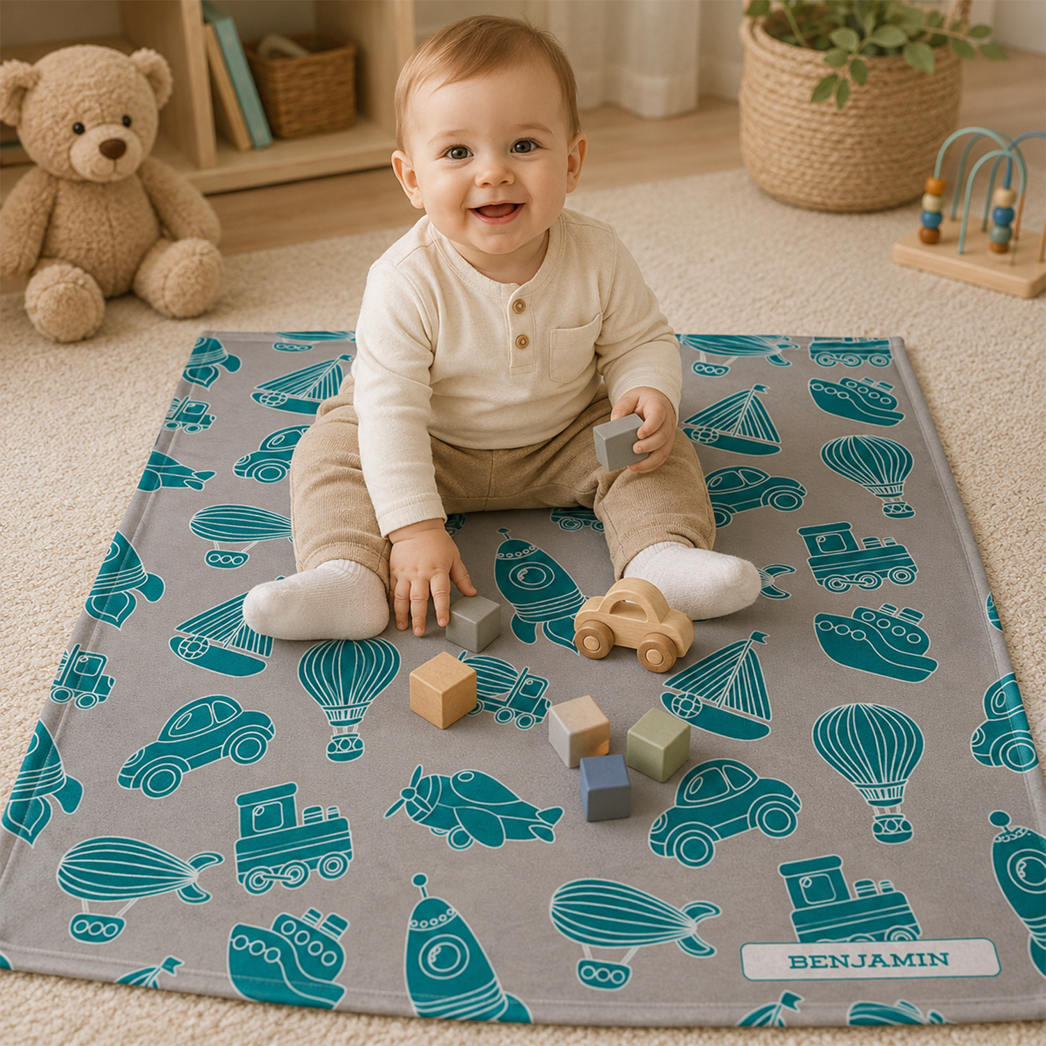 Close-up of custom name on toys gray and teal fleece baby blanket design
