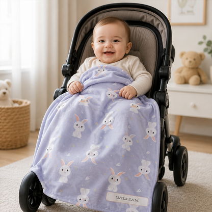 Baby wrapped in personalized white rabbit periwinkle fleece blanket as shower gift
