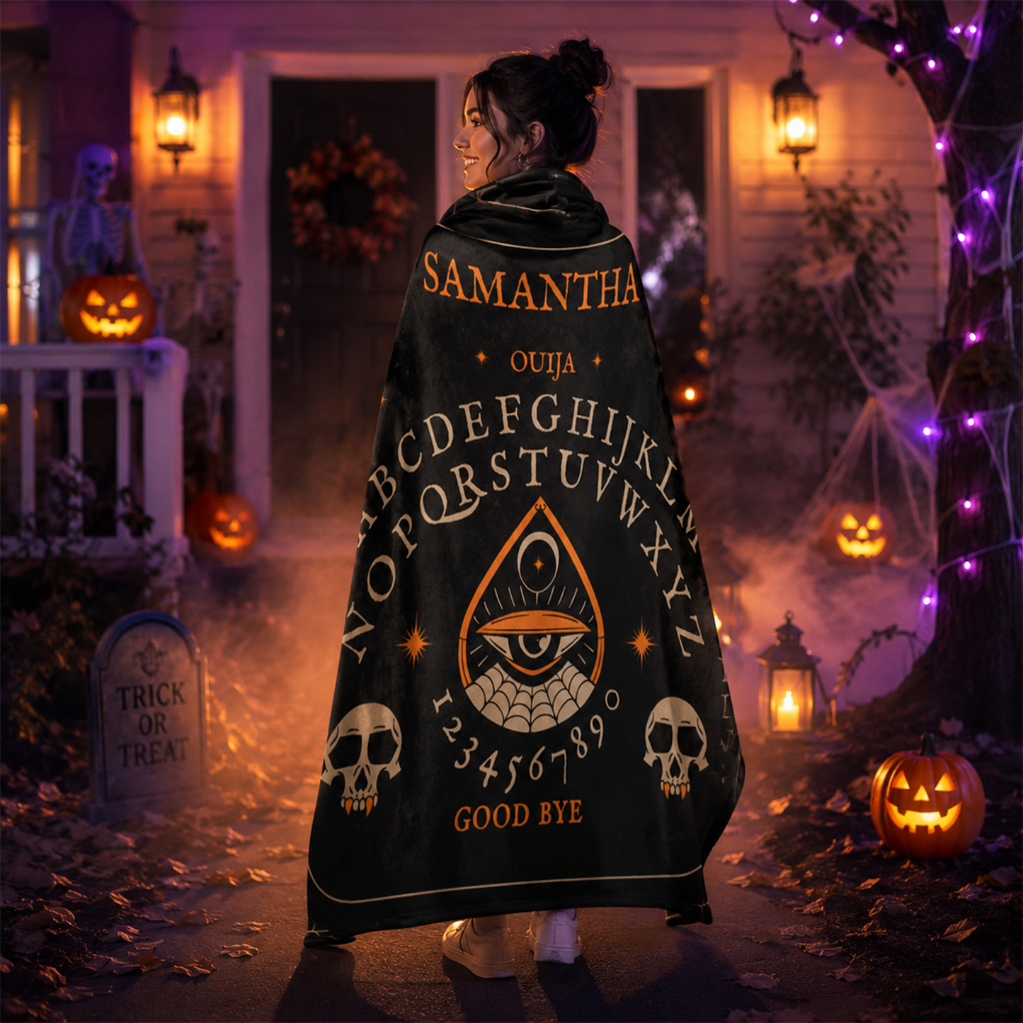 Person wrapped in ouija board throw blanket as spooky Halloween seasonal gift
