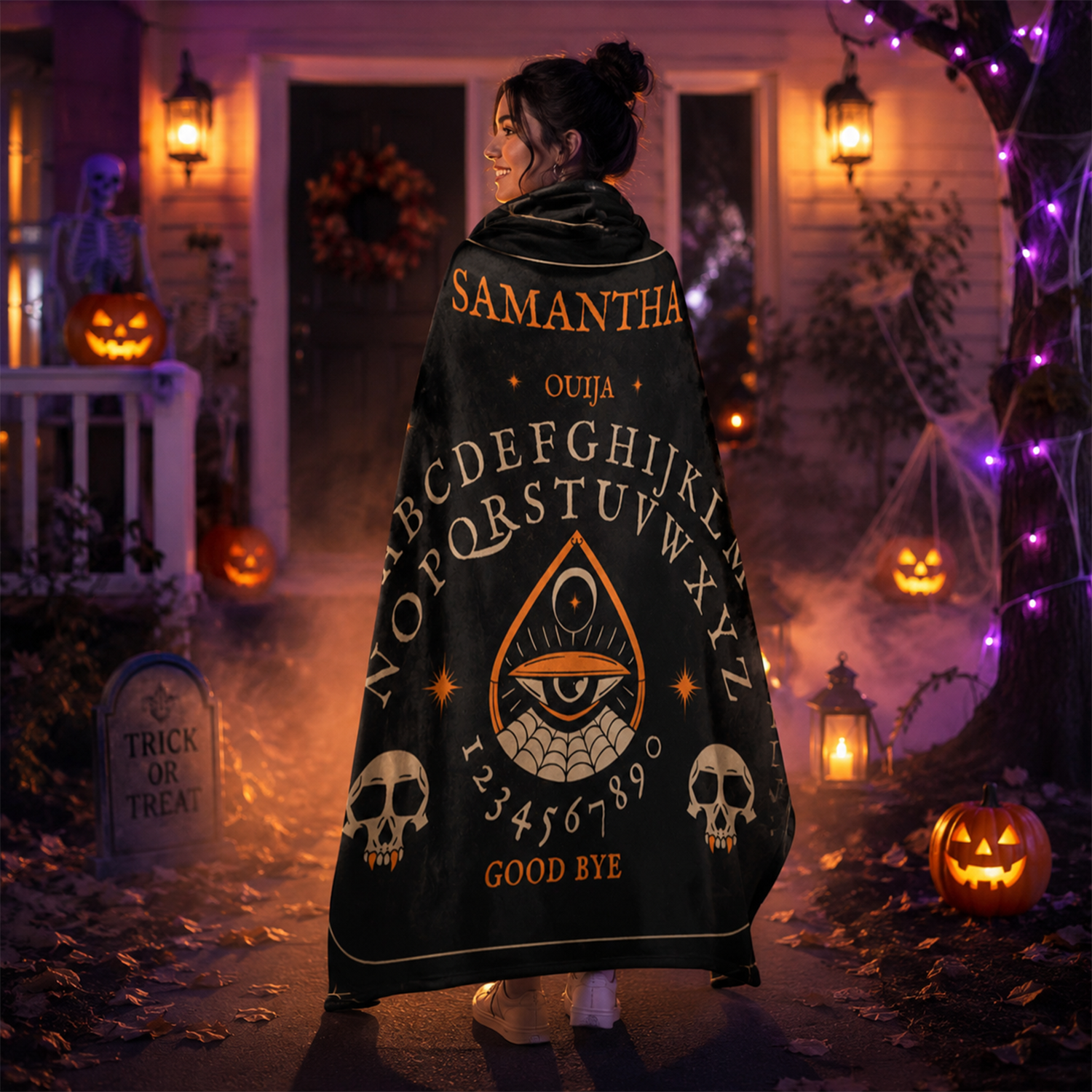 Person wrapped in ouija board throw blanket as spooky Halloween seasonal gift
