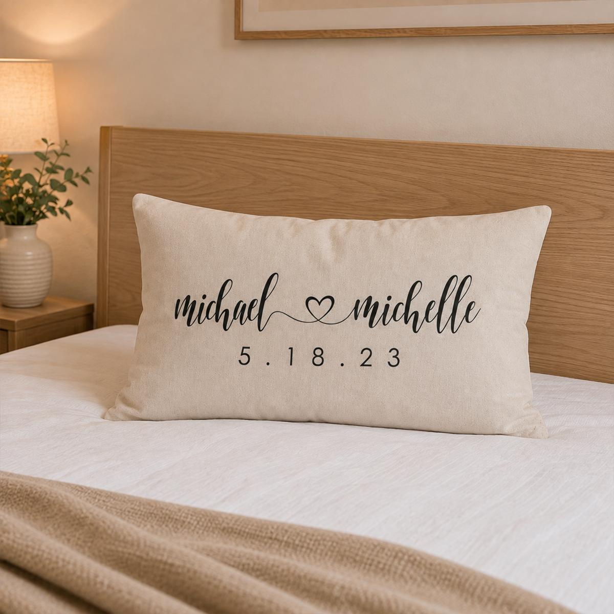 Wedding monogram lumbar pillow on sofa showing full 12 by 24 cotton cover design
