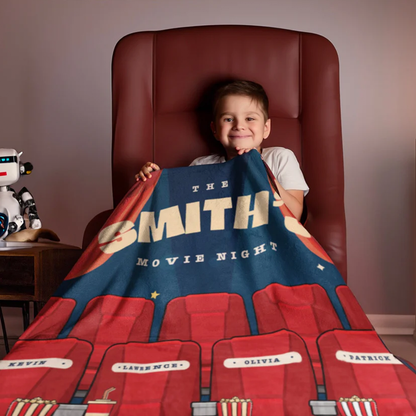 Movie night custom names throw blanket laid flat on couch for home cinema setup
