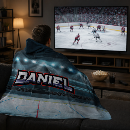 Hockey player wearing personalized hooded fleece blanket as birthday sports gift
